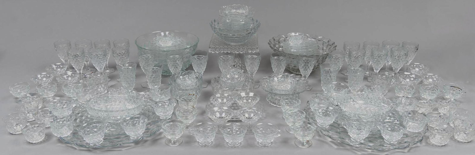 Collection of Approx. (150) Fostoria "American" Glass: Collection of approx. one hundred and fifty pieces of vintage Fostoria "American" glass punch dessert set, to include patterened pieces, bowls, punch bowls, cups, wine glasses, platters, etc 7