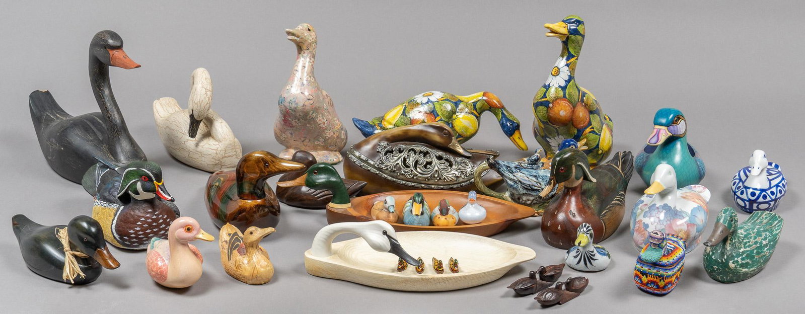Collection of (32) Decorative Ducks: Collection of thirty-two mixed-media decorative ducks, to include a variety of manufacturers such as Tom Taber and Gallo Design, featuring work by Mexican artist Sergio Bustamante 14"h x 17"w 