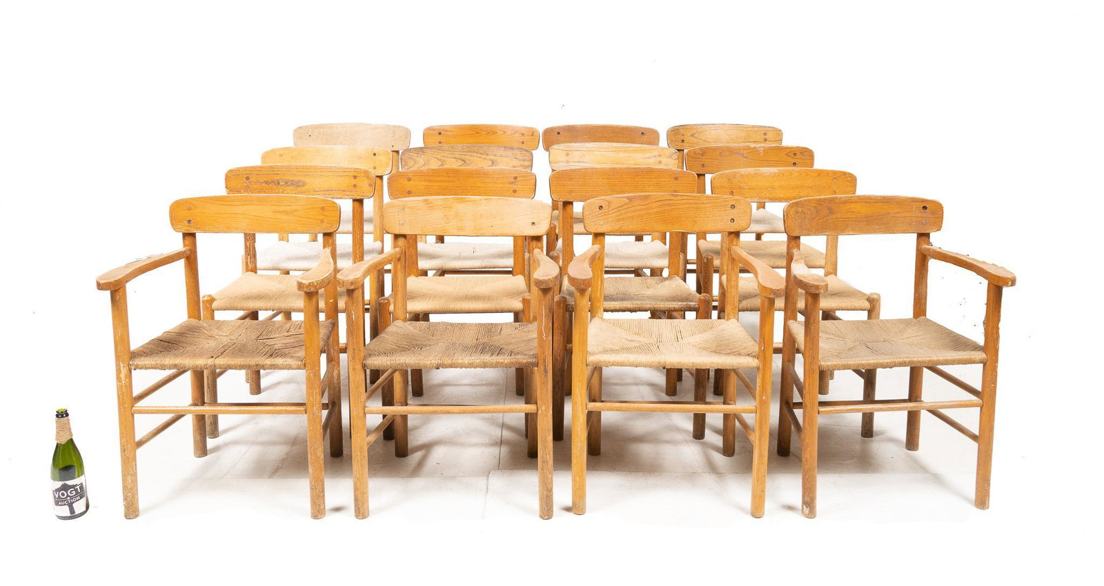 Set of (40) Rush Seat Provincial Chairs: Set of forty Provincial arm chairs, featuring wooden frame with rush seat 31.5"h x 19.5"w x 16"d/ each Note: Only sixteen chairs were photographed Condition: Good to fair condition throughout Provena