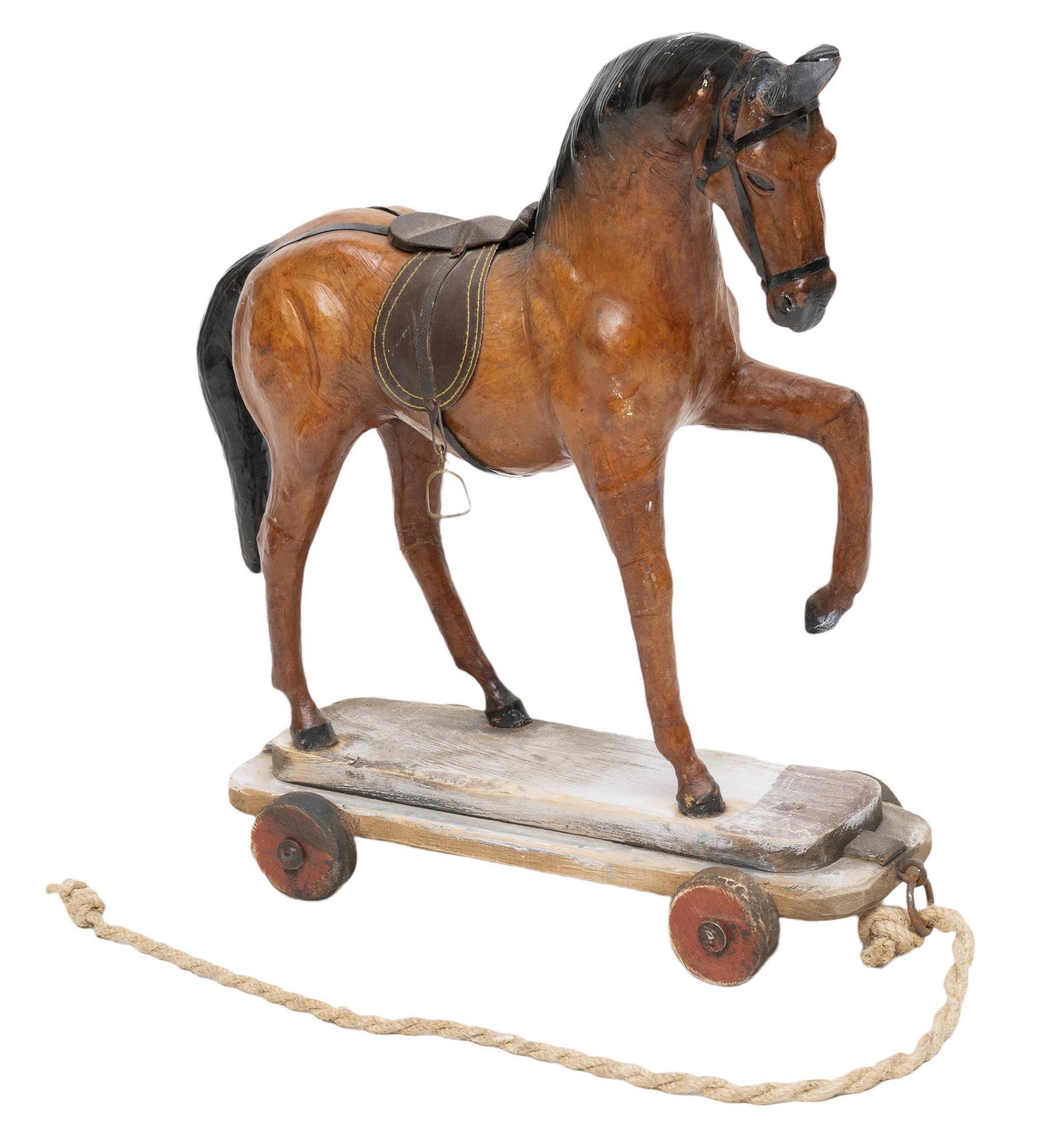 Vintage Toy Horse on Wheels: Vintage toy horse, having leather upholstery, supported on wooden base with wheels and pull rope 20.5"h x 21"w x 7.5"d We happily provide seamless shipping services on everything we sell. Please ema