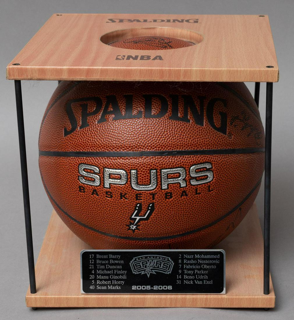 Pair of San Antonio Spurs Signed Basketballs, 2005-2006: Pair of San Antonio Spurs signed basketballs, inside wooden and glass cases, 2005-2006 9.5"h x 9.5"w x 9.5"d Provenance: A San Antonio, Texas collection We happily provide seamless shipping services o