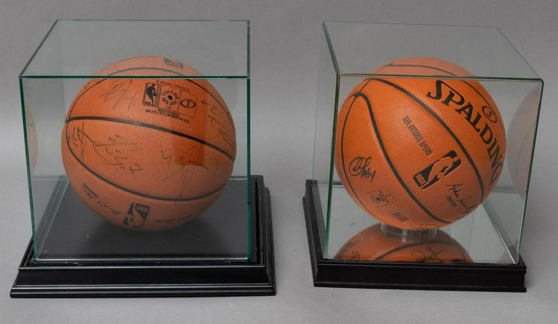 Pair of Signed San Antonio Spurs Basketballs: Pair of signed San Antonio Spurs Basketballs, inside glass cases 10"h x 10"w x 10"d/ largest Note: Unauthenticated Provenance: A San Antonio, Texas collection We happily provide seamless shipping se