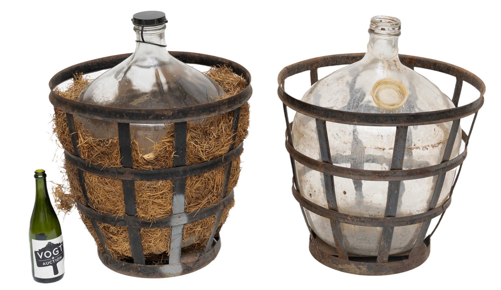 Pair of Vintage Hand-Blown Carboys: Pair of vintage hand-blown glass lidded carboys inside iron basket, one to include hay lining 27"h x 19.5"d We happily provide seamless shipping services on everything we sell. Please email us at ship