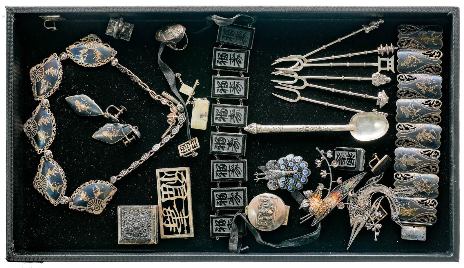 Collection Vintage Siam Niello Jewelry: Vintage Siam enameled sterling silver bracelets, earrings, brooches; as well as two 800-900 fine German travel theme charm bracelets. Total weight 285.1 grams We happily provide seamless shipping se