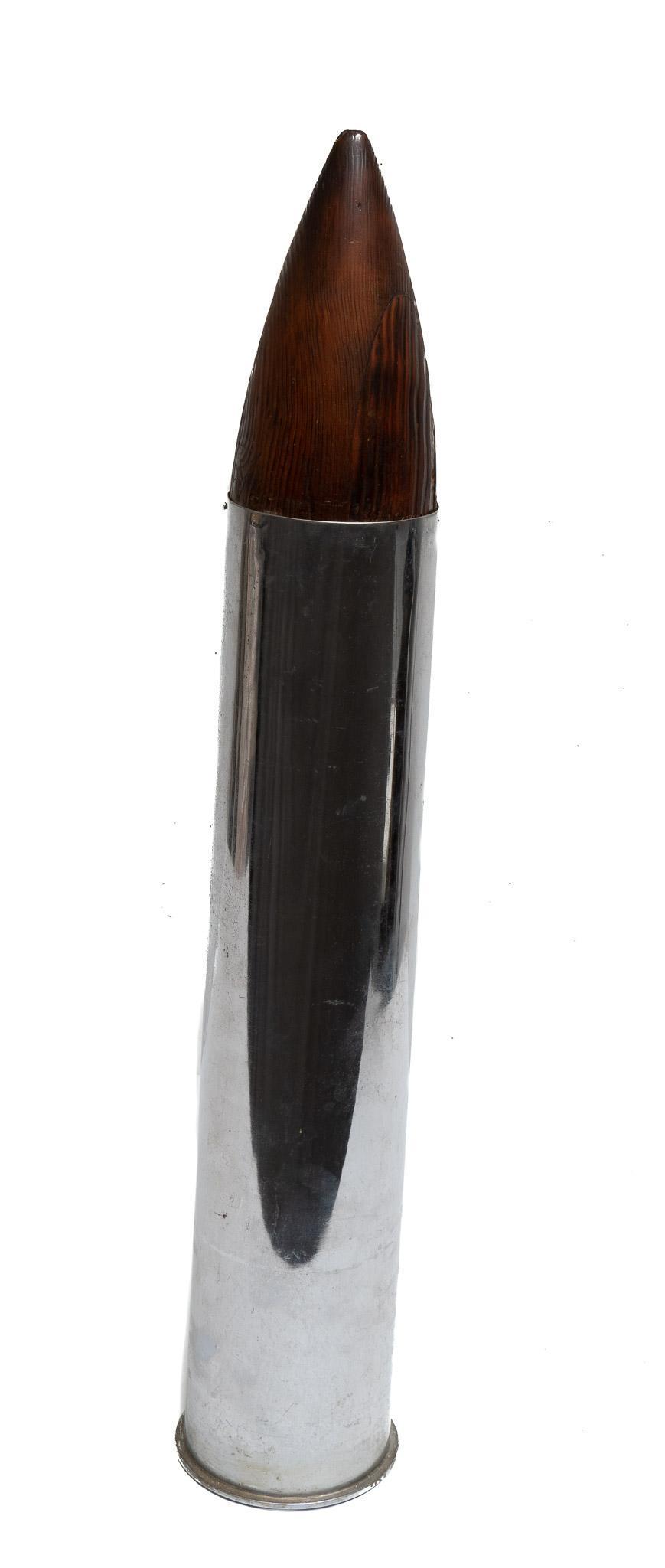 Inert Ceremonial Artillery Shell: Measurements: 36" tall x 6" dia. Marked: 5 IN MK 10 MOD I 38 CAL Includes: polished stainless shell w/ wooden dummy round Condition: light wear throughout shell; light rusting on bottom of she