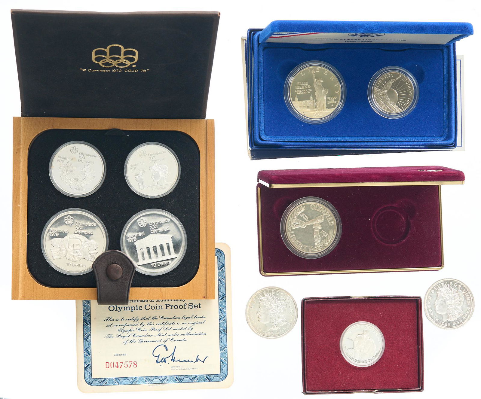 Lot of Miscellaneous Collectible Silver Coins: Includes: Canada Olympic coin proof set, 1986 Liberty proof deep cameo silver dollar, (2) 1-oz .999 fine silver commemorative coins with an obverse imitating the Morgan dollar, 1988 Olympic silver pro