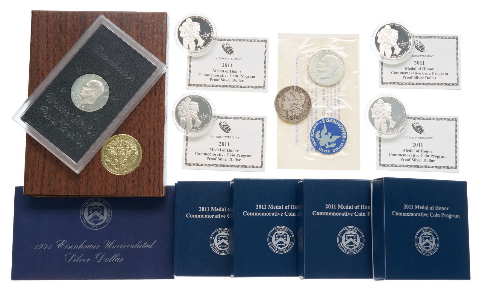 Lot of Miscellaneous American Silver Coinage: Includes: (4) 2011 silver medal of honor proof coins with box and certificate of authenticity COA, (1) 1888-O Morgan silver dollar Good to Very Good, (2) 1971-S Eisenhower 40% silver dollars - 1 proof