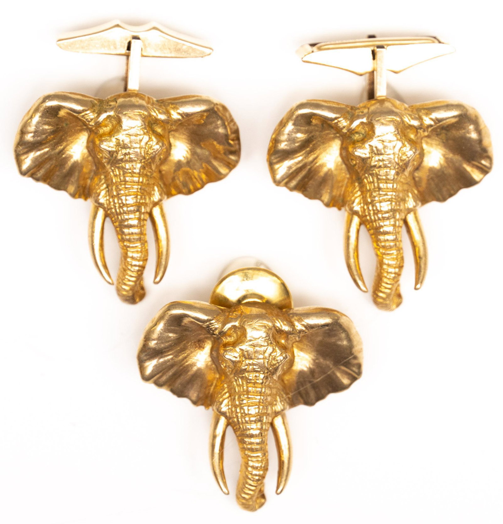 Vintage 10k Gold Elephant Cufflinks Tie Tack Set: Multidimensional solid 10k gold elephant cufflinks with matching tie tack; toggle backs are gold filled. Elephants 1; square; total weight 28.5 grams Provenance: A San Antonio, Texas collection We hap