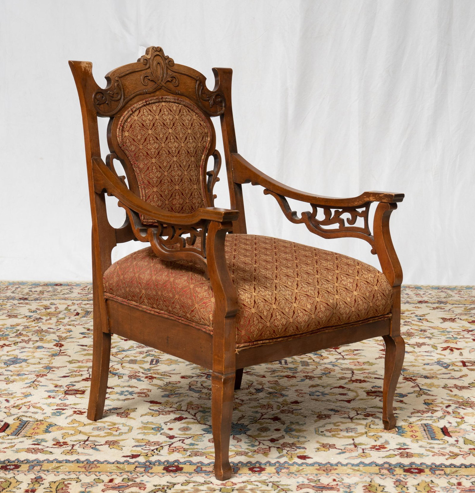 French Arm Chair: French arm chair having scrolled arms and upholstered seat and back cushion 37"h 23"w x 23 1/2"d Provenance: A San Antonio, Texas collection