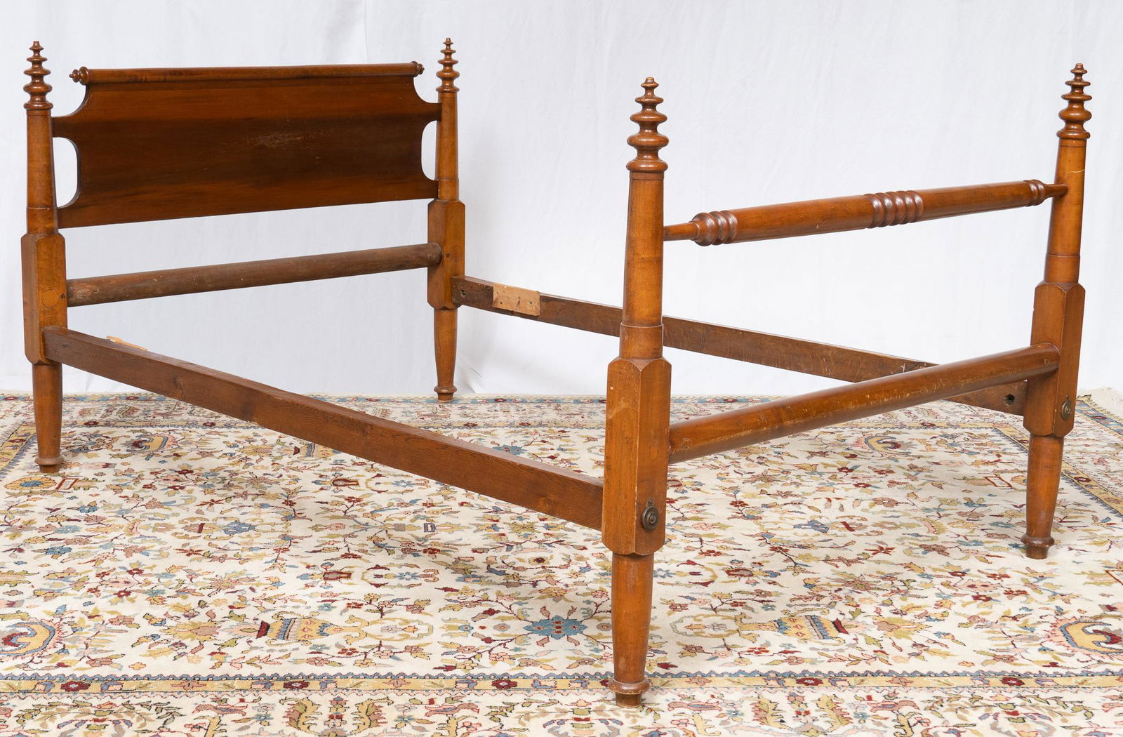 Hand-Carved Rope Bed: Antique American maple rope bed featuring spooled accents, rising on turned legs, circa late 19th century 42"h x 55"w x 80"d Provenance: A San Antonio, Texas collection We happily provi