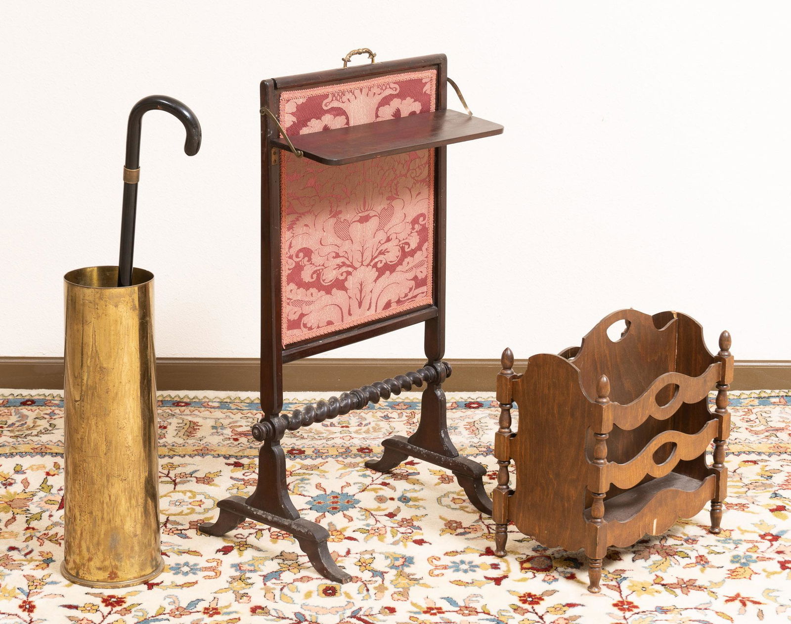 (4) Pieces of Entryway furniture: Set of four pieces of entryway furniture, to include newspaper stand, cane with hidden compartment, silk screen, brass artillery shell umbrella stand 36"h x 19"w x 15"d Provenance: A San