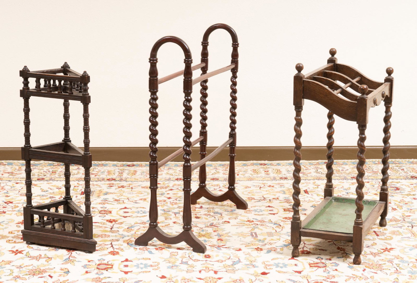 Collection of Spooled Furniture (3): Collection of spooled furniture, to include two wooden umbrella stands, having turned accents, one blanket rack 33 1/2"h x 27"w x 11"d / largest Provenance: A prominent Terrell Hills, Texas collection