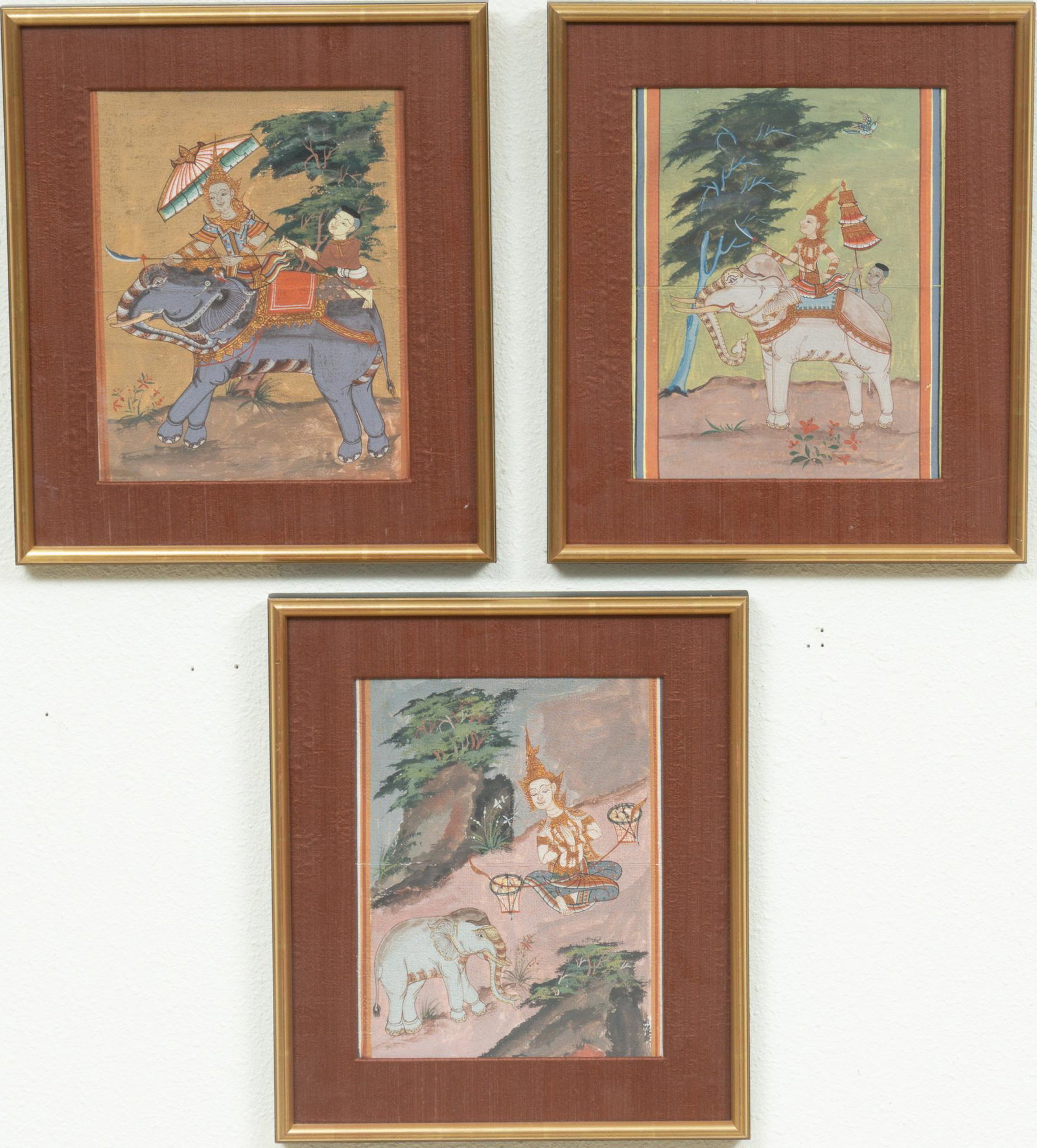Set of (3) Cambodian Artworks: Set of three Cambodian artworks depicting elephant riders, mixed media on paper, framed 16"h x 13 1/2"d Note: other artworks attributed to same artist to be sold in auction Provenance: A Waco,