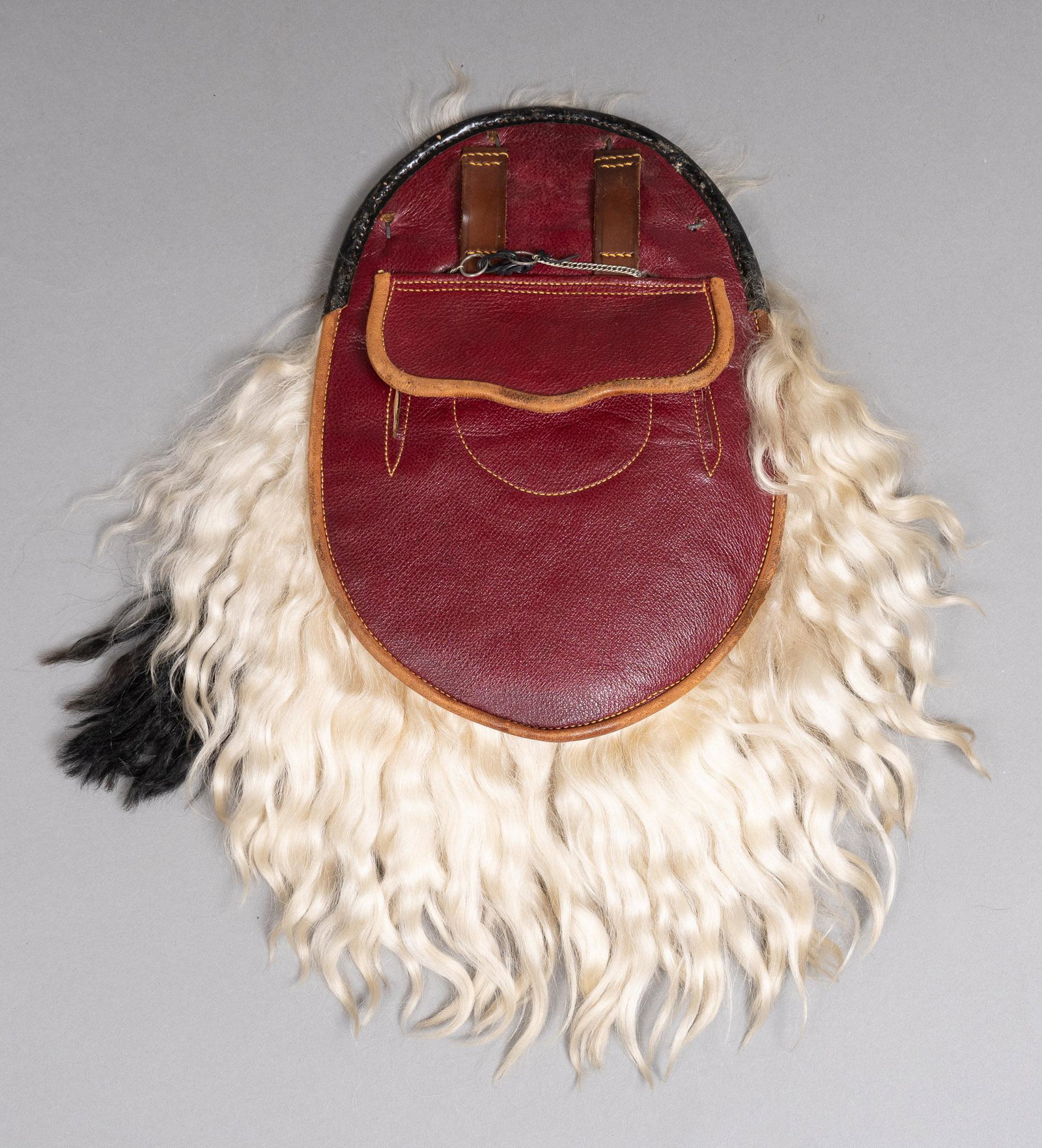 Scottish Sporran: Scottish leather Sporran, having hair front and tassels 15"h x 13"w x 3"d Provenance: A prominent Terrell Hills, Texas collection We happily provide seamless shipping services on everything we sell. P