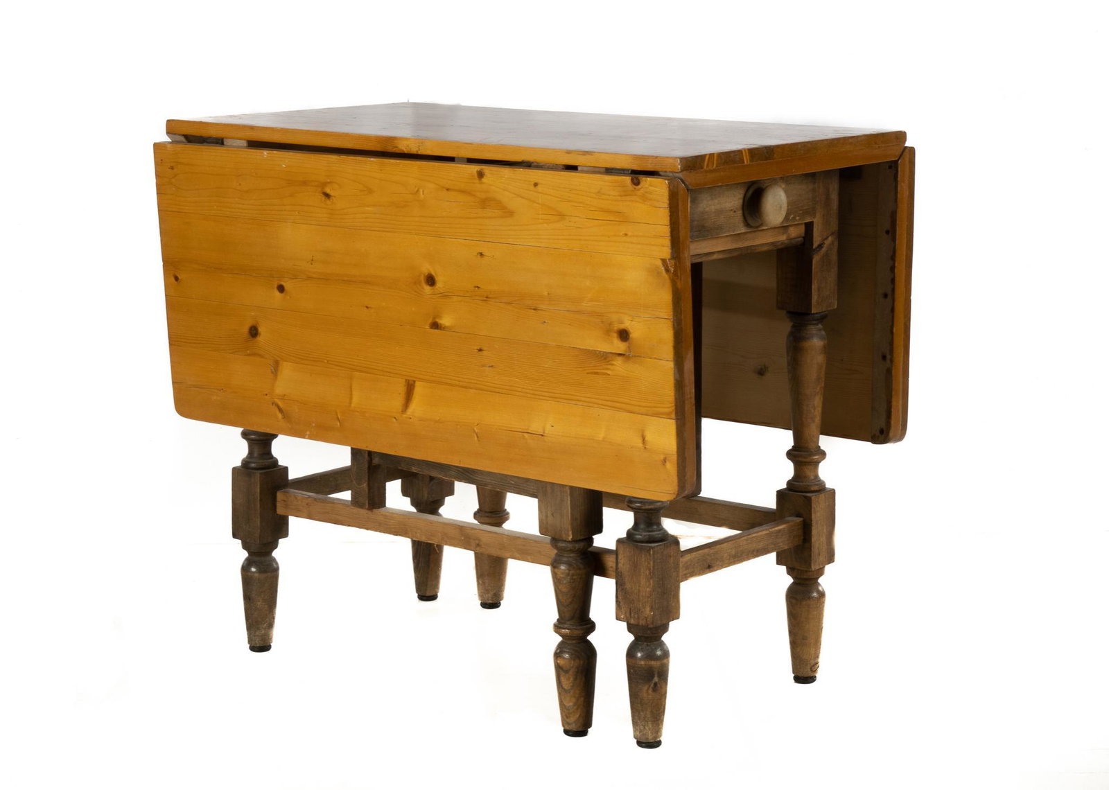 Gate Leg Table: Wooden drop-leaf table, having two hinged leaves and one drawer rising on turned stretchered legs 30"h x 21"w x 35"d, extended: 30"h x 51w x 35"d Provenance: A San Antonio, Texas collection We happily