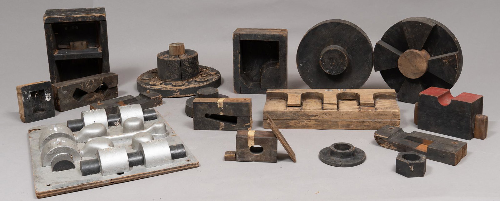 Collection of (18) Alamo Works Molds: Collection of eighteen Alamo Iron Works molds, mostly wooden San Antonio's first major industrial employer, Alamo Iron Works once stood in the current location of the Alamodome. From the early 1880's,