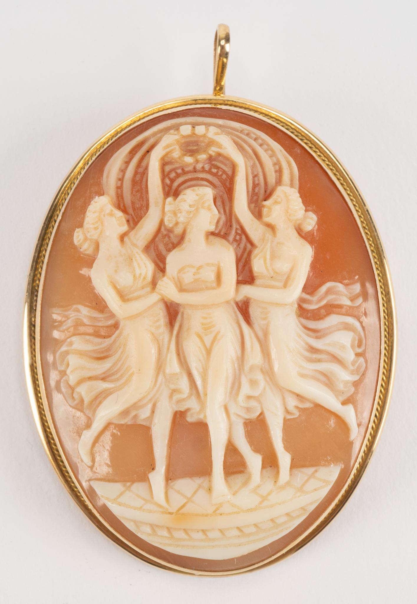 Vintage Three Graces 18k Gold Shell Cameo: Vintage shell cameo of the three graces in 18k yellow gold setting with brooch bar and pendant loop. Height 1 5/8", width 1 1/4"; total weight 10.7 grams We happily provide seamless shipping service