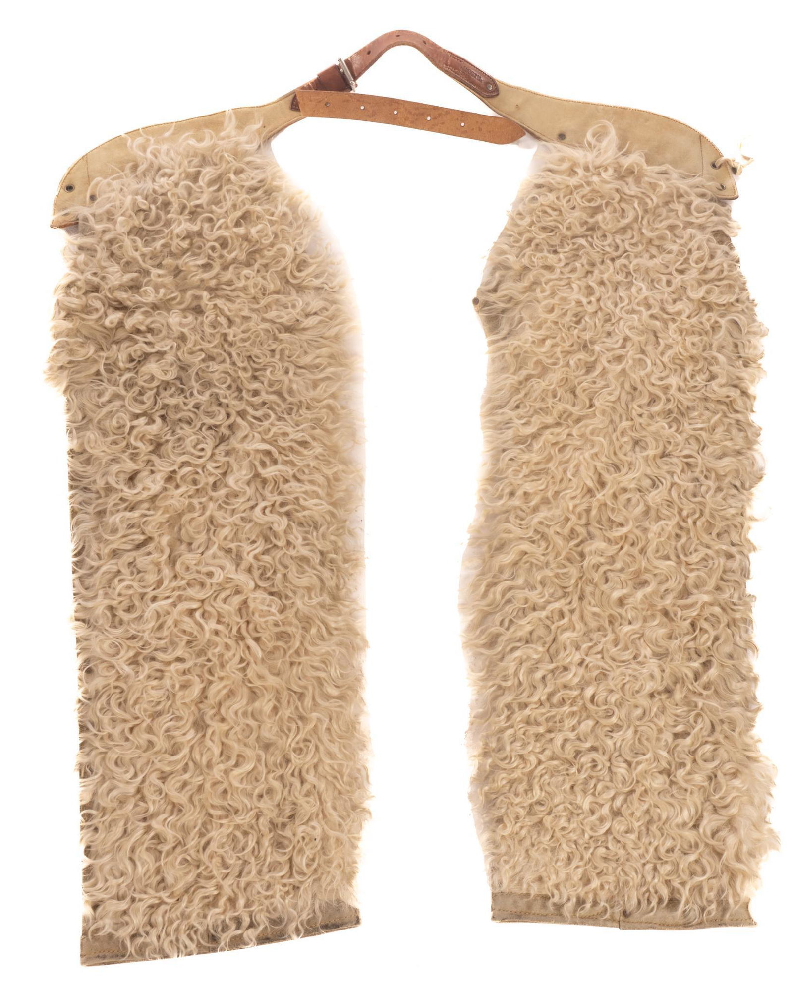 Pair of Hamley & Co. Chaps: Pair of Hamley & Co. sheepskin chaps, featuring sheep wool front, marked 41"h x 32"w x 3"d Provenance: A Hamilton, Texas collection We happily provide seamless shipping services on everything we s