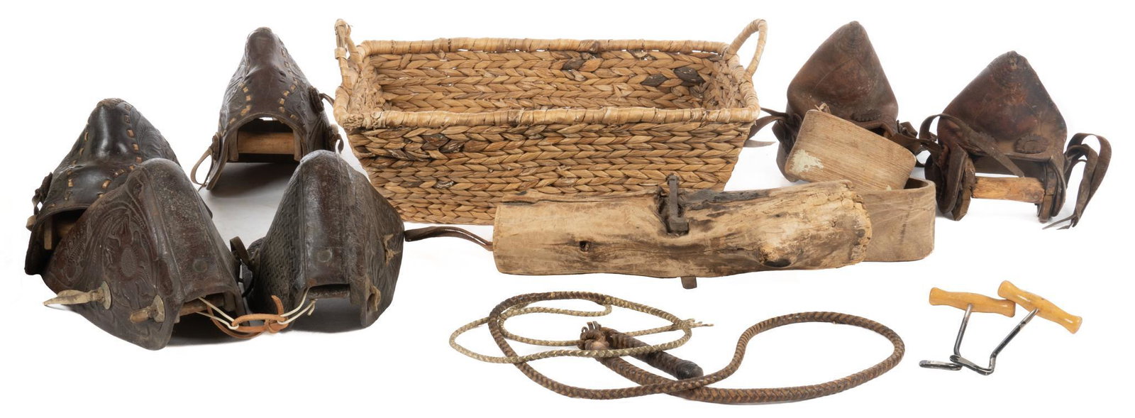 Collection of (8) Farmhouse Accessories: Collection of vintage Farmhouse accessories, to include tooled leather stirrups, horsewhip, horse shoe picks, etc. 13"h x 8"w x 9"d / tallest Provenance: A Hamilton, Texas collection We happily provid