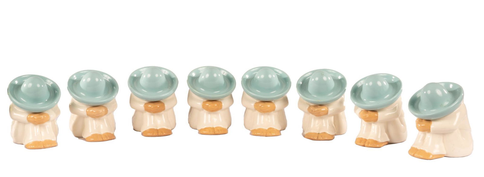 Set of (8) HOMCO Sleeping Man Figurines: Set of eight matching HOMCO (TX) sleeping man porcelain figurines 7.5"h x 5"w x 6"d Provenance: A San Antonio, Texas collection We happily provide seamless shipping services on everything 