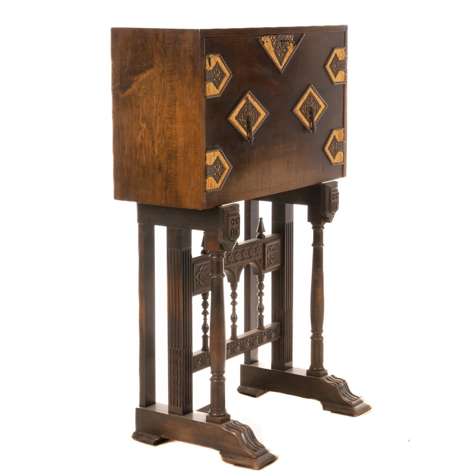 Hastings Spanish Renaissance Style Vargueno: Spanish Renaissance style Hastings vargueno (desk), featuring banded iron drop front, opening to interior pigeon holes, supported on carved trestle legs, featuring floral motif, marked by manufacturer