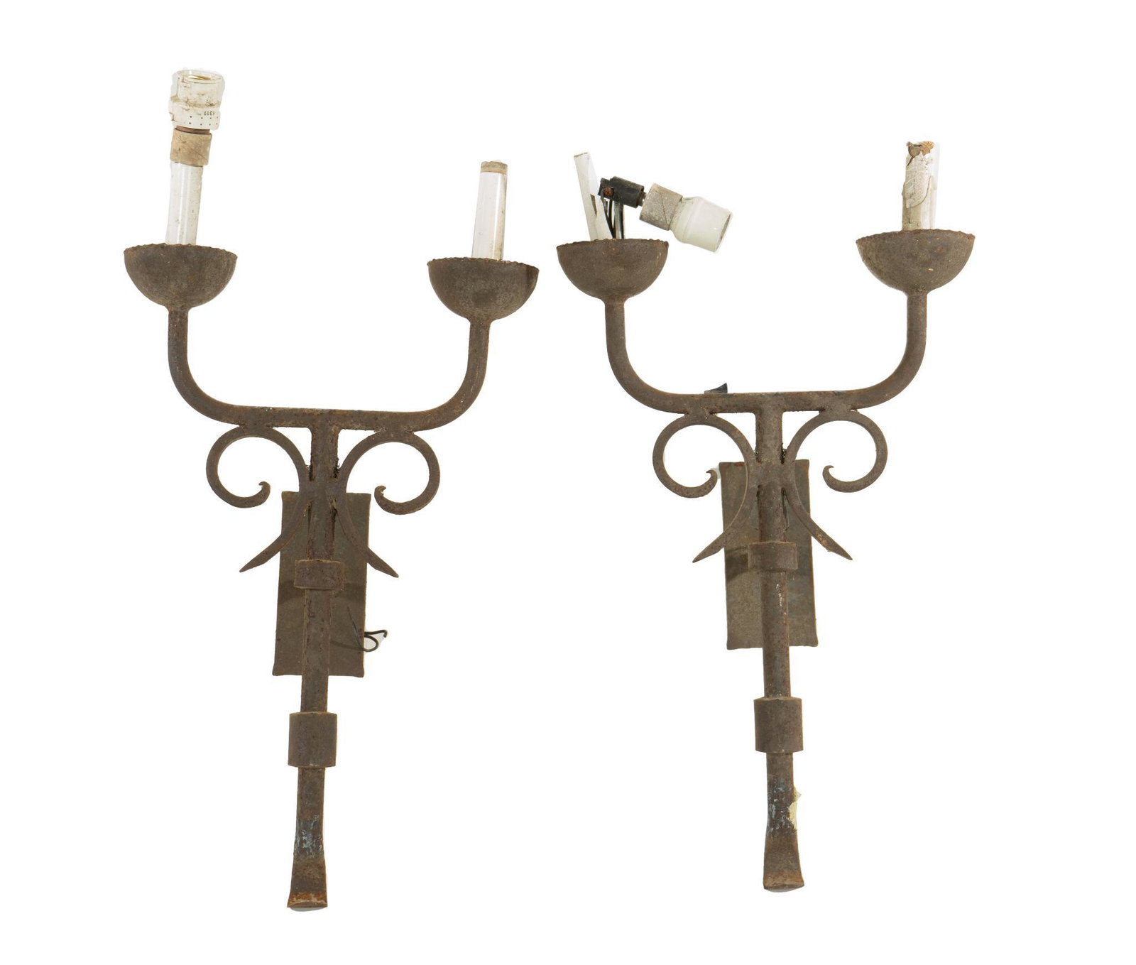 Pair of Scrolled Iron Wall Candelabras: Pair of matching scrolled iron wall candelabras, supporting electric faux candles, to include wiring 24"h x 13"w x 9"d Provenance: From the former compound of Horse of a Different Color (S