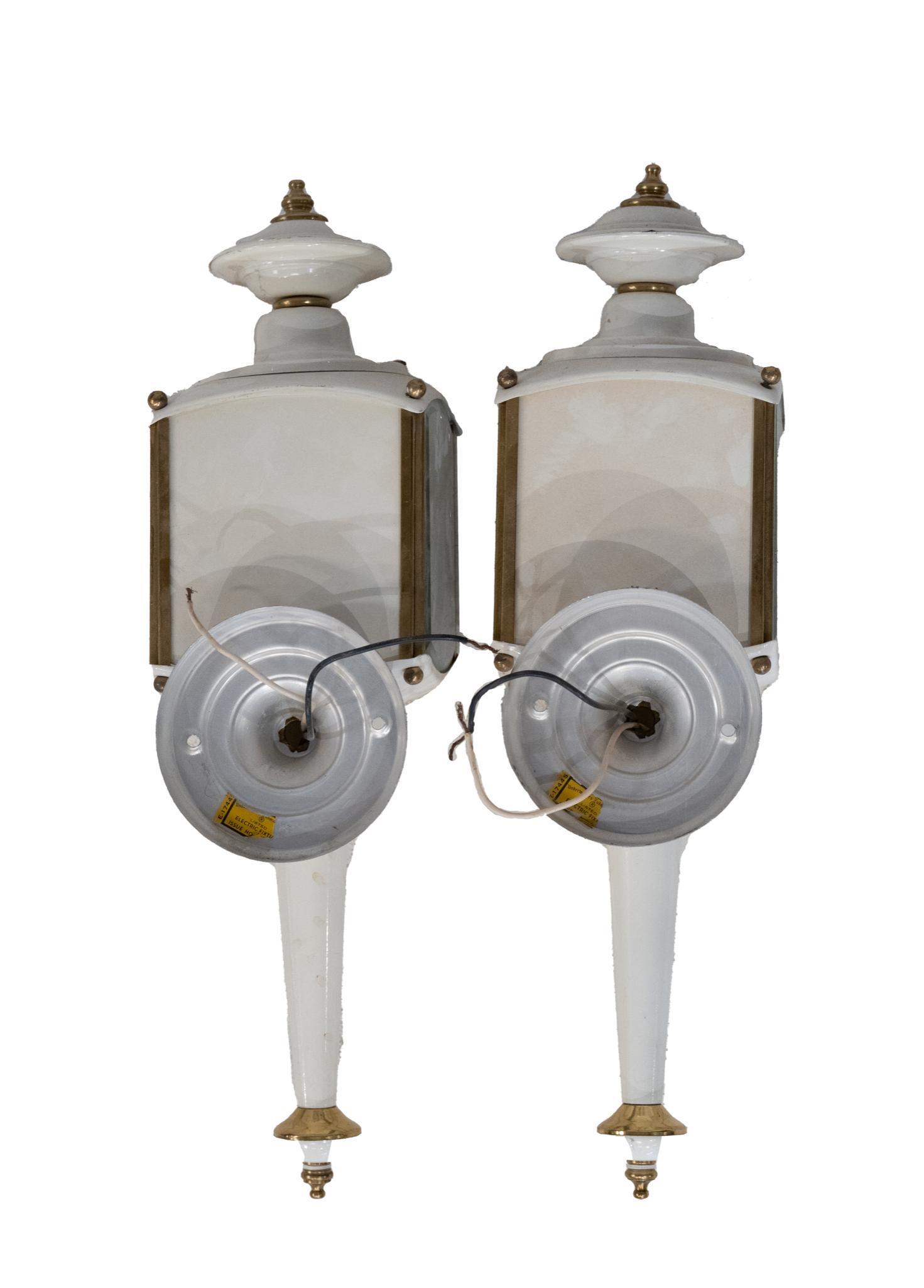 Pair of Carriage Lamps: Pair of carriage lamps, having white body, gilt accents 19"h x 5"w x 7"d Provenance: Inventory from the now-closed Charlott's Antiques (San Antonio, Texas) We happily provide seamless 