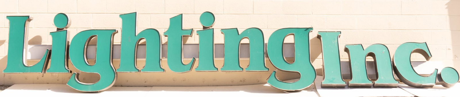 Large 'Lighting' Sign: Large format store sign in two parts, spelling the words 'Lighting' and 'Inc.', previously from the Lighting Inc store in San Antonio, TX 31.5"h x 223.5"w x 5.5"d We happily provide seamless shipping 