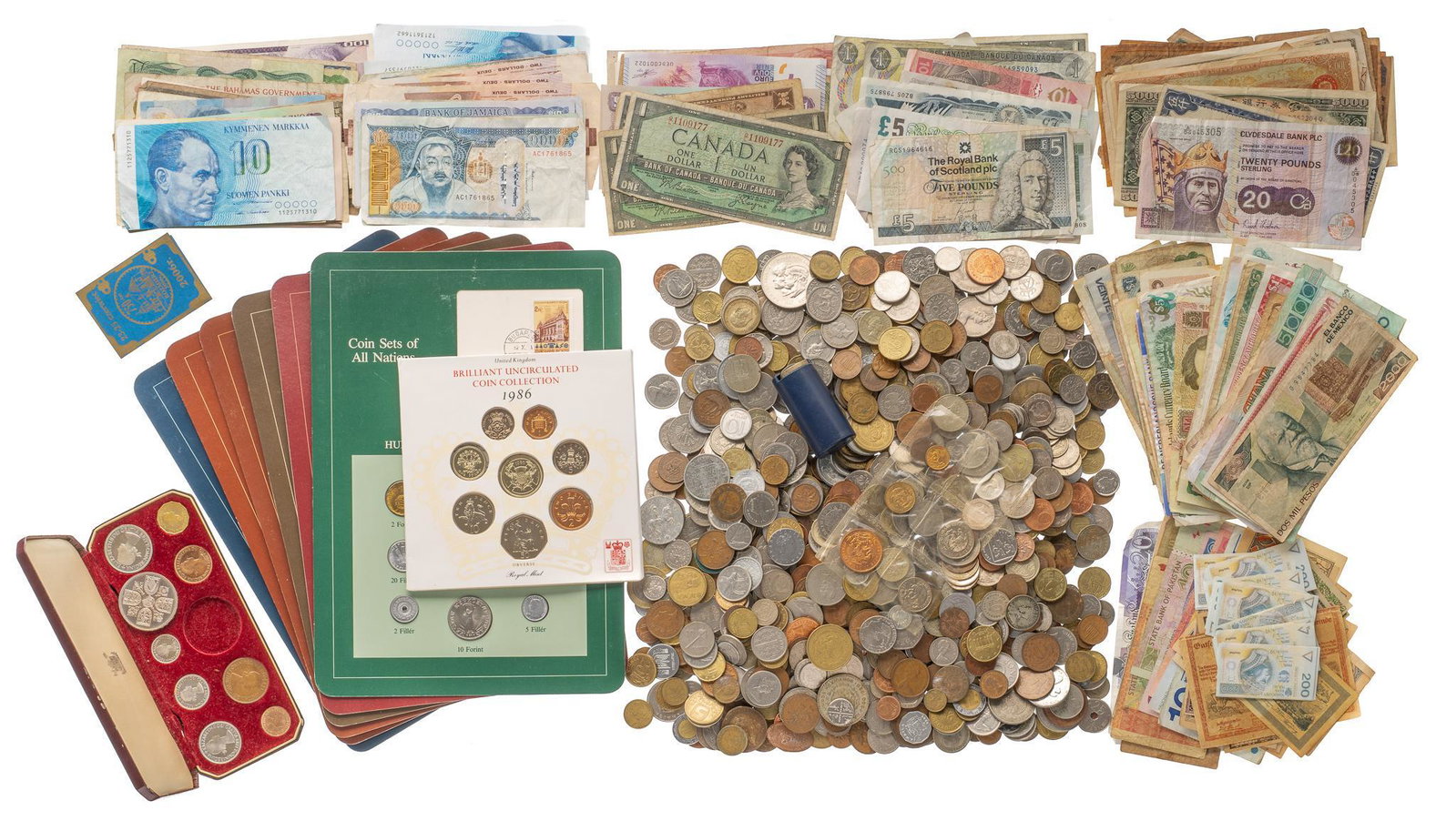 Mixed Foreign Currency & Coins: Includes: Mixed paper currency & coins from many nations, Including Canada, Finland, Mongolia, the UK, French Polynesia and more. Provenance: The Estate of Doug King, Bandera, Texas We happily pro