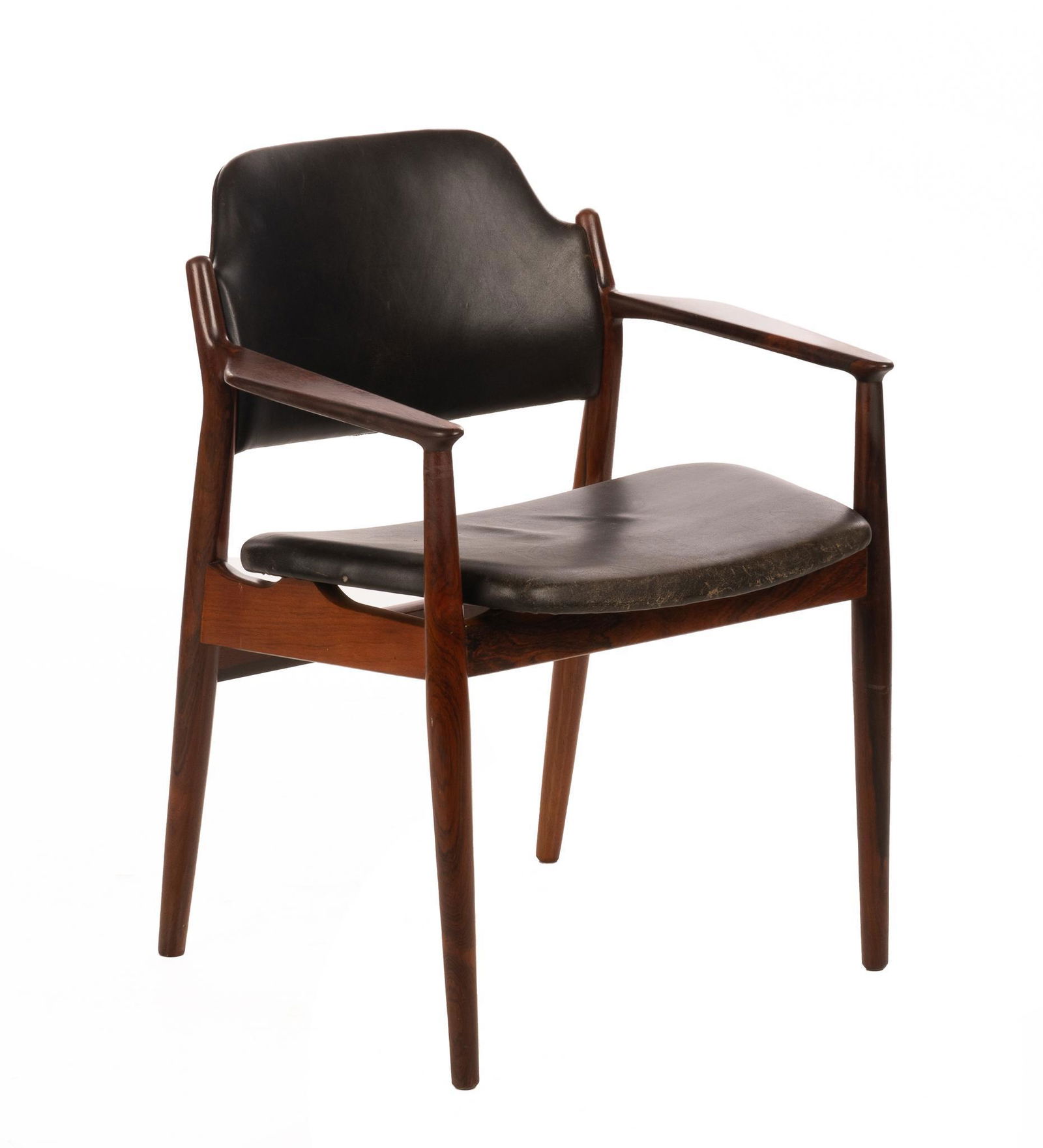Arne Vodder (1926-2009, DNK), Mid-Century Leather Armchair: Arne Vodder (1926-2009, Denmark), designed for Sibast, having black leather upholstery, saddle seat, supported in wooden frame, rising on pin legs 31.5"h x 24.5"w x 23"d We happily provide seamless