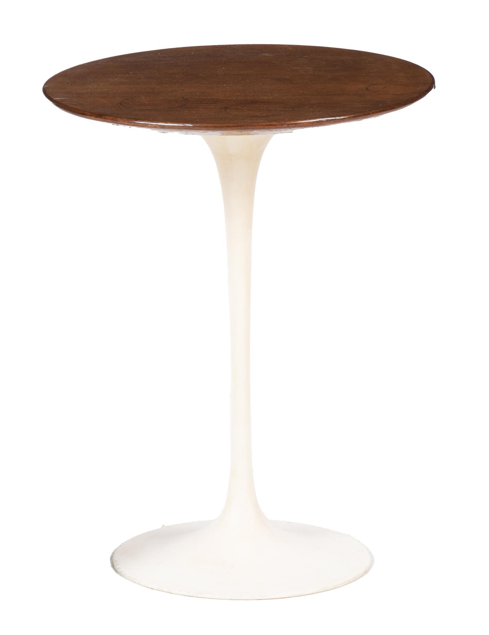 Mid-Century Knoll Tulip Side Table: Mid-Century Knoll International tulip side table, having round walnut veneer top, supported on tapered iron base, marked 20"h x 16"d Condition: Chip at base, Cup rings on top Provenance: A Lake Medina