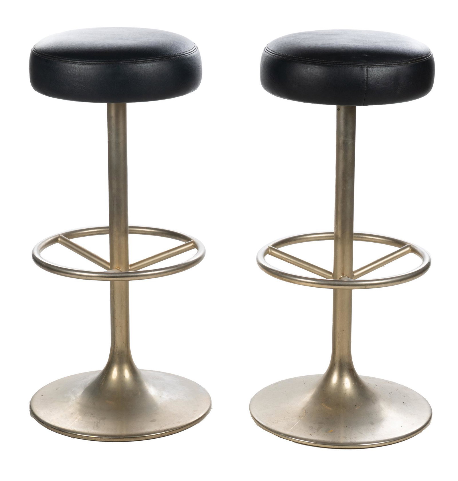 Pair of Mid-Century Bar Stools: Pair of Mid-Century bar stool, featuring black swivel seat, rising on tapered chrome base, with footrest 32"h x 16"w x 16"d We happily provide seamless shipping services on everything we sell. Please 