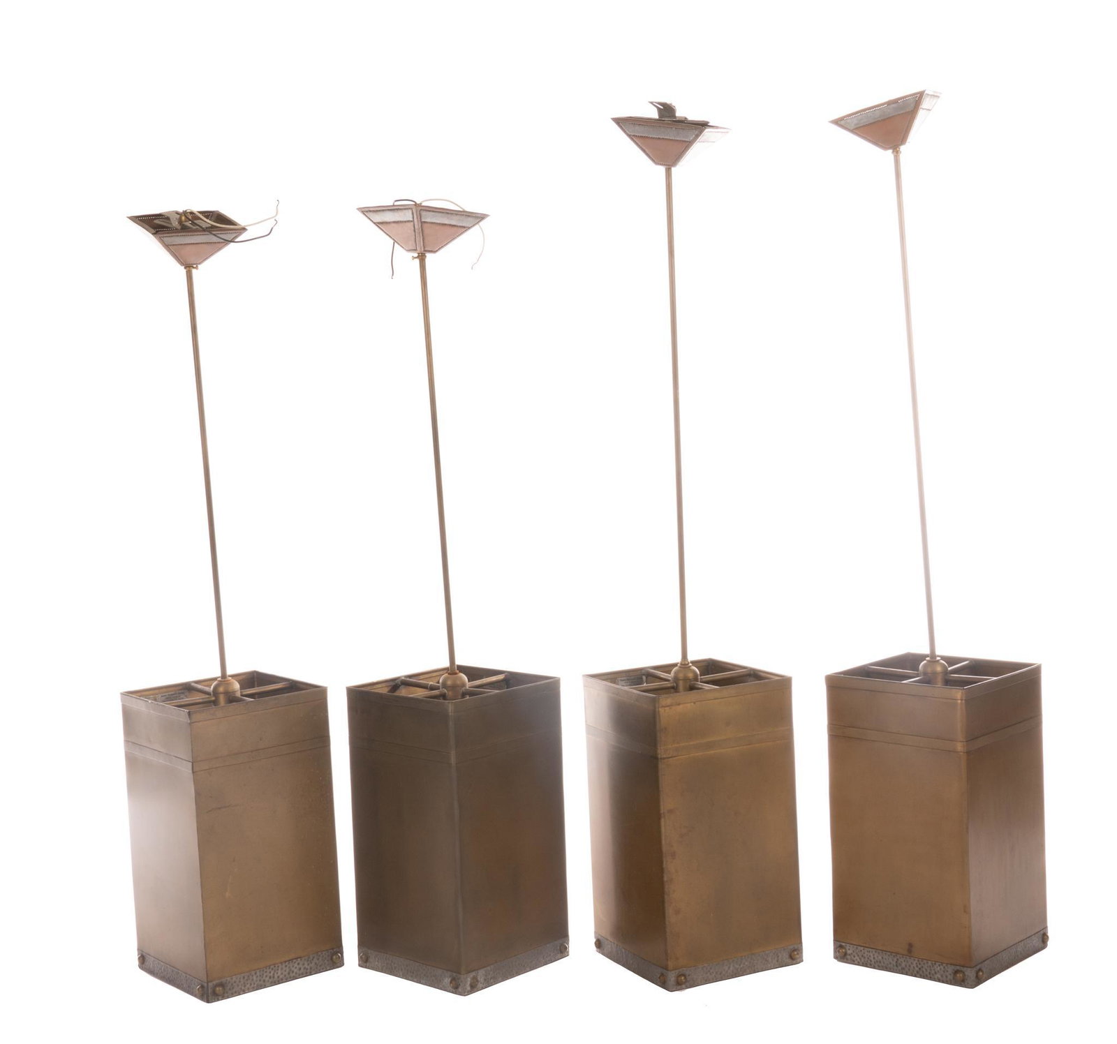 Isaac Maxwell (San Antonio, TX) Set of (4) Hanging Light Fixtures: Isaac Maxwell (San Antonio, TX), pair of matching hanging light pendants, having copper body, hammered metal trim, to include wiring The spectacle of intricately patterned silhouette lighting is a dis