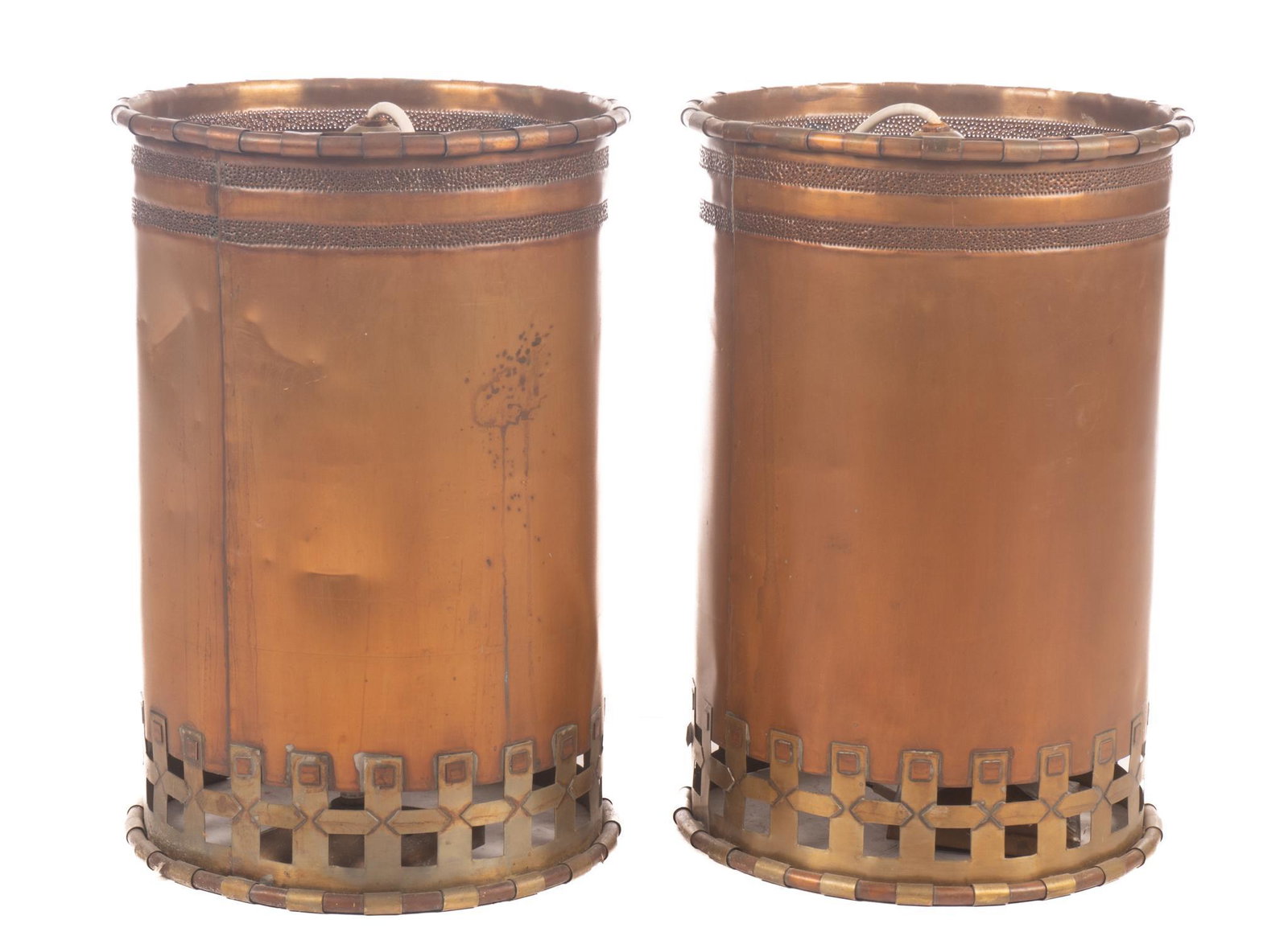 Isaac Maxwell (San Antonio, TX) Pair of Hanging Light Fixtures: Isaac Maxwell (San Antonio, TX), pair of matching hanging light pendants, having copper body, punched accents, brass lattice, to include wiring The spectacle of intricately patterned silhouette lighti