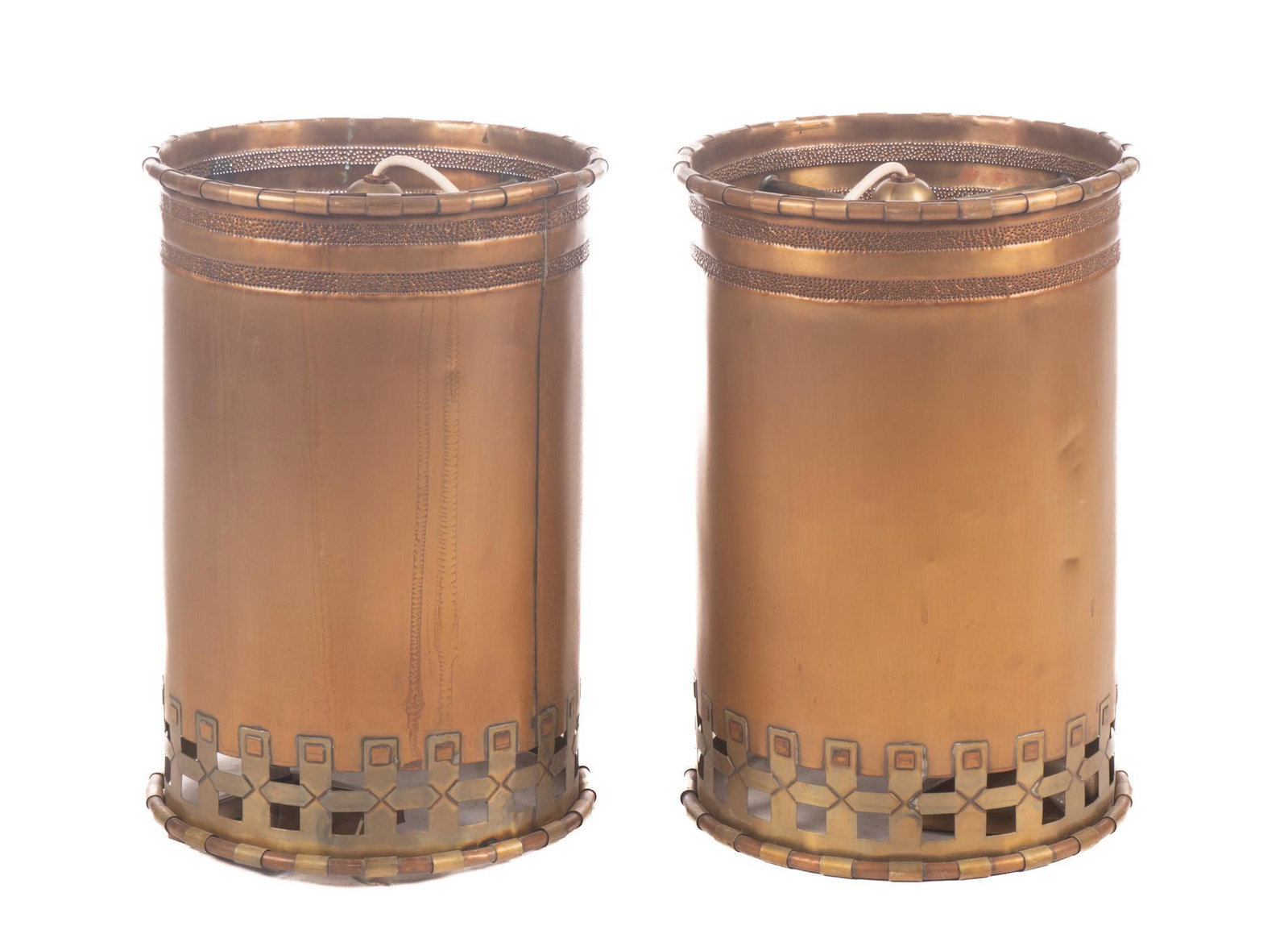Isaac Maxwell (San Antonio, TX) Pair of Hanging Light Fixtures: Isaac Maxwell (San Antonio, TX), pair of matching hanging light pendants, having copper body, punched accents, brass lattice, to include wiring The spectacle of intricately patterned silhouette lighti