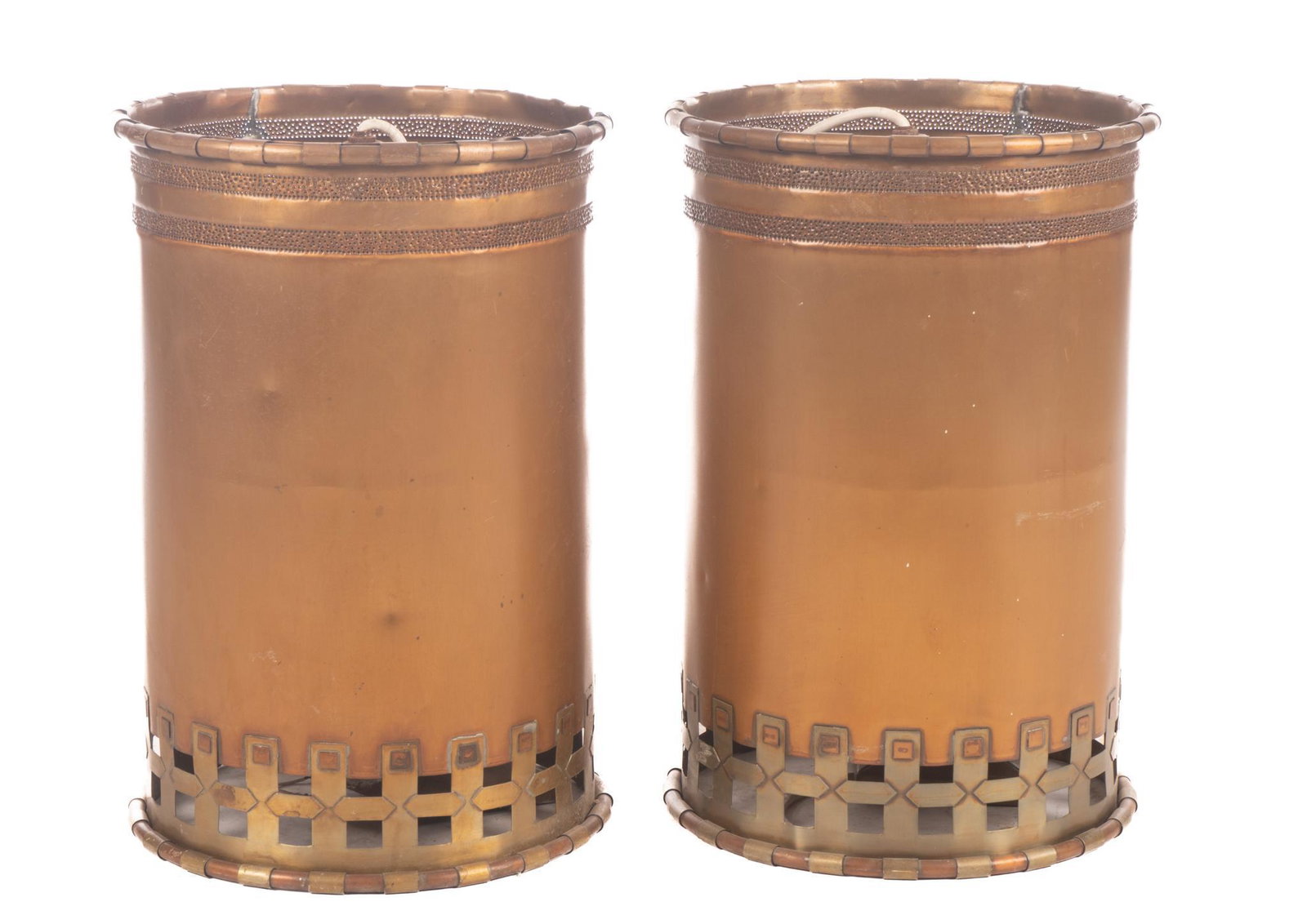 Isaac Maxwell (San Antonio, TX) Pair of Hanging Light Fixtures: Isaac Maxwell (San Antonio, TX), pair of matching hanging light pendants, having copper body, punched accents, brass lattice, to include wiring The spectacle of intricately patterned silhouette lighti