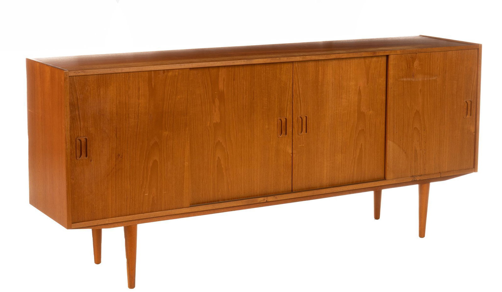 Danish Mid-Century Sideboard: Danish Mid-Century sideboard, having sliding doors, leading to interior shelves, rising on pin legs 33"h x 65"w x 16.5"d We happily provide seamless shipping services on everything we sell. Please ema