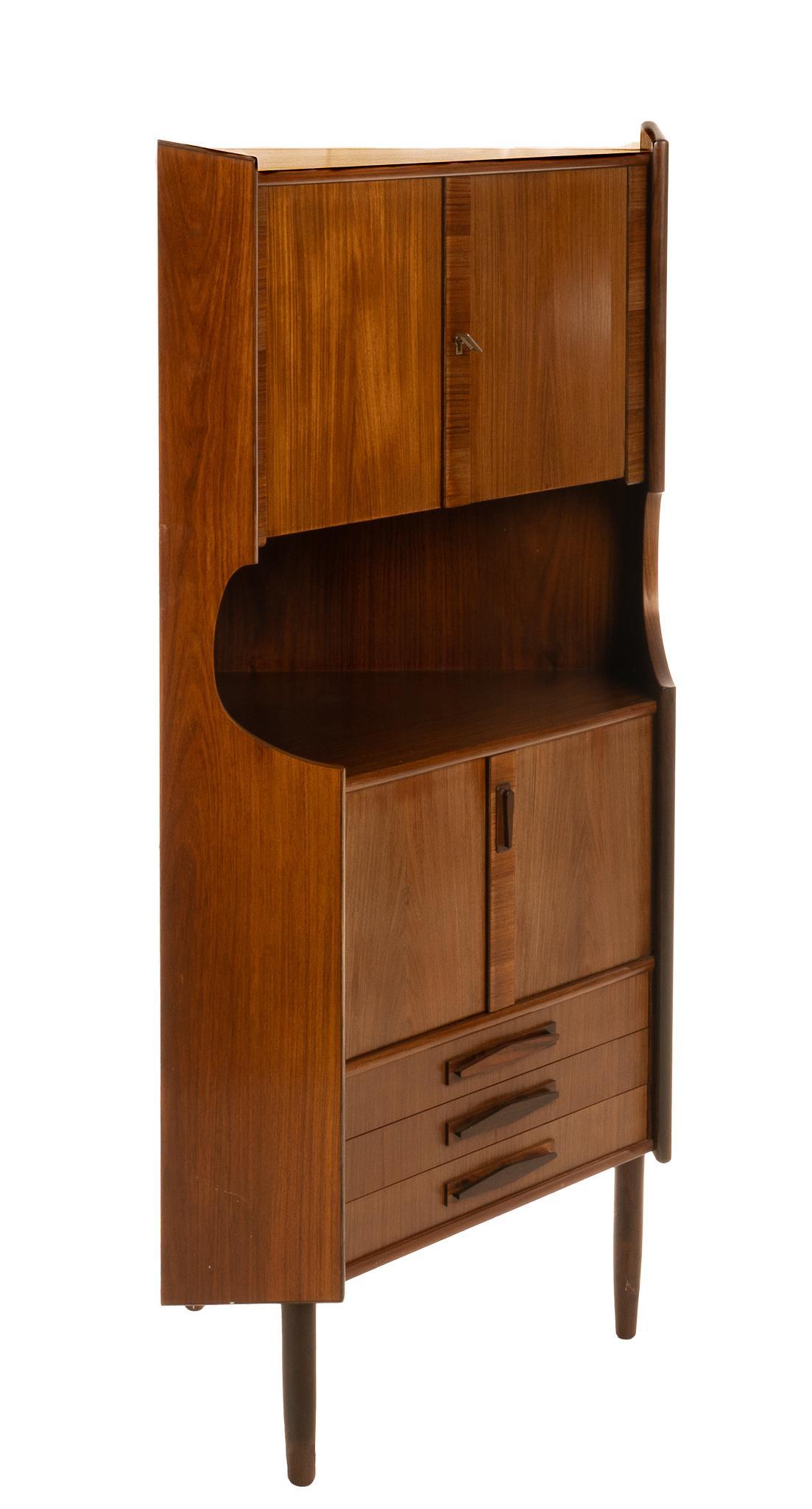 Danish Mid-Century Corner Bar Cabinet: Danish Mid-Century cocktail corner cabinet, having upper tier, with cabinet doors, leading to mirror backed shelved interior, featuring geometric motif, above counter space, cabinet doors opening to i