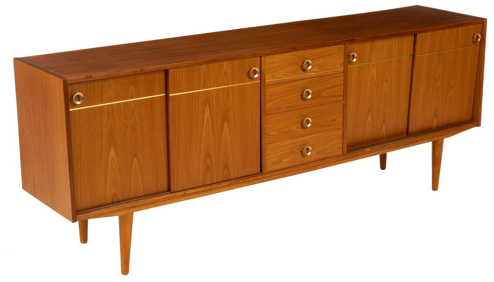 Danish Mid-Century Credenza: Danish Mid-Century credenza/sideboard, having stack of drawers, flanked by sliding doors, leading to interior shelving, featuring brass circle hardware, rising on pin legs 29.5"h x 78.5"w x 17"d Condi