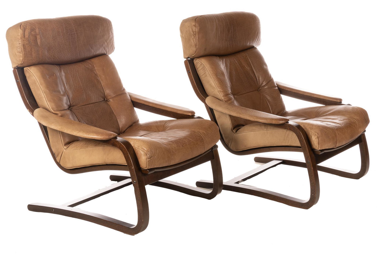 Pair of Danish Mid-Century Armchairs: Pair of matching Danish Mid-Century armchairs, having tufted leather upholstery, rising on sled legs 36"h x 31"w x 36"d We happily provide seamless shipping services on everything we sell. Please emai