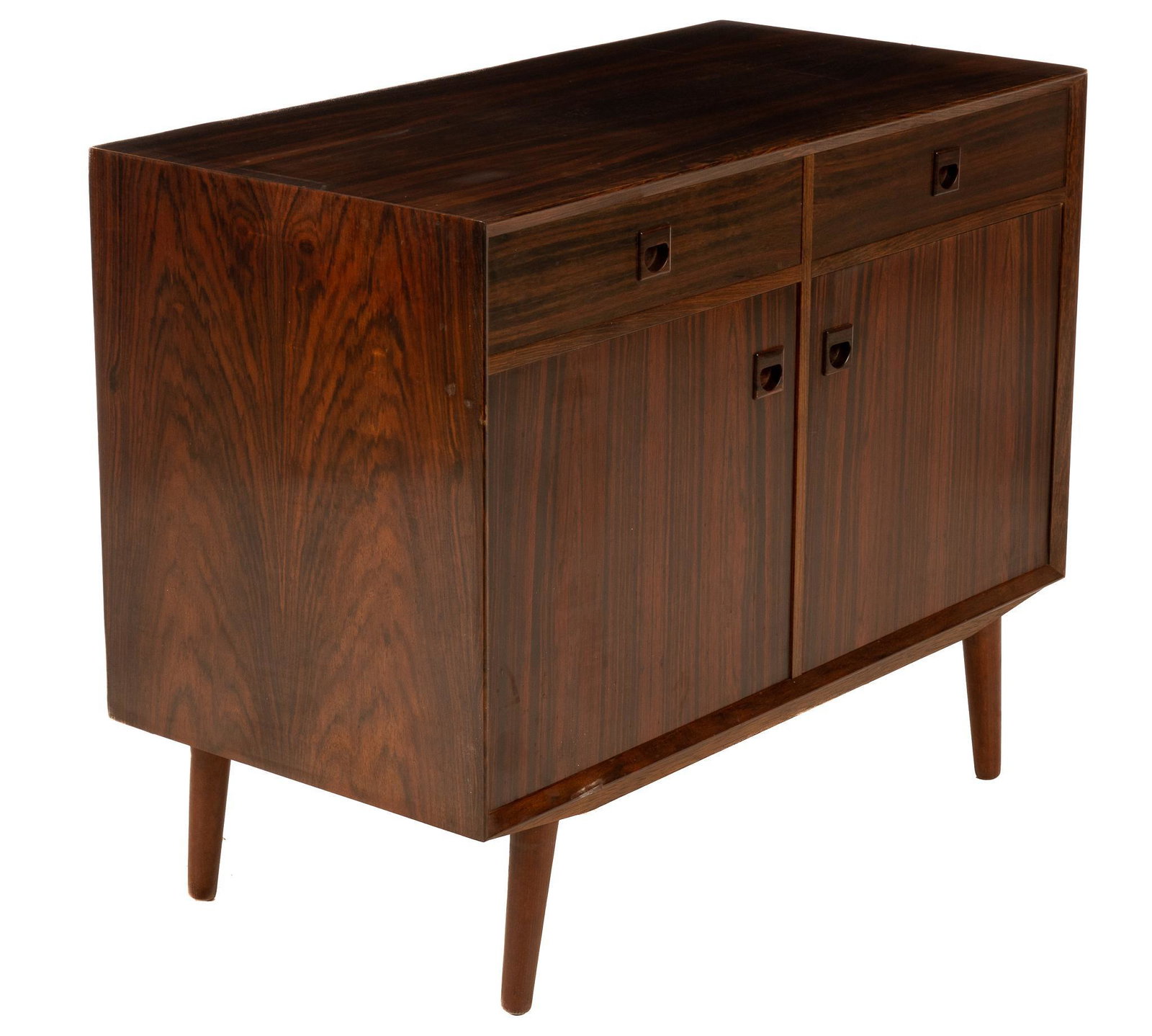 Danish Mid-Century Credenza: Danish Mid-Century rosewood credenza/sideboard, having drawers, over cabinet doors, leading to interior shelf, rising on pin legs 31.5"h x 39.5"w x 19.5"d We happily provide seamless shipping services