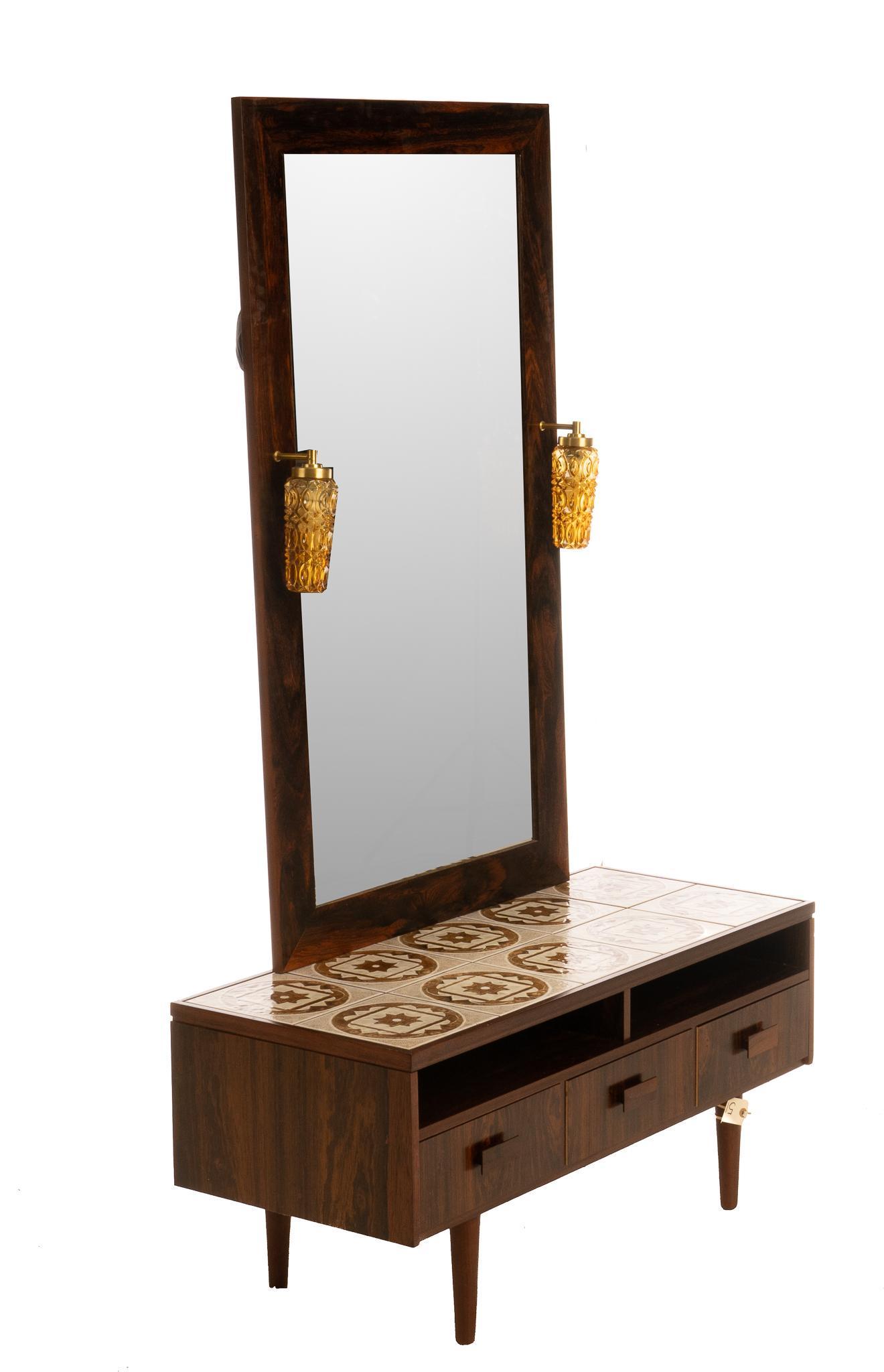 Danish Mid-Century Console with Wall Mirror: Danish Mid-Century tile top console, featuring geometric design, to include matching mirror, featuring glass lanterns, marked Mirror: 49.5"h x 28"w x 5"d,Console: 18"h x 49"w x 17"d We happily provide