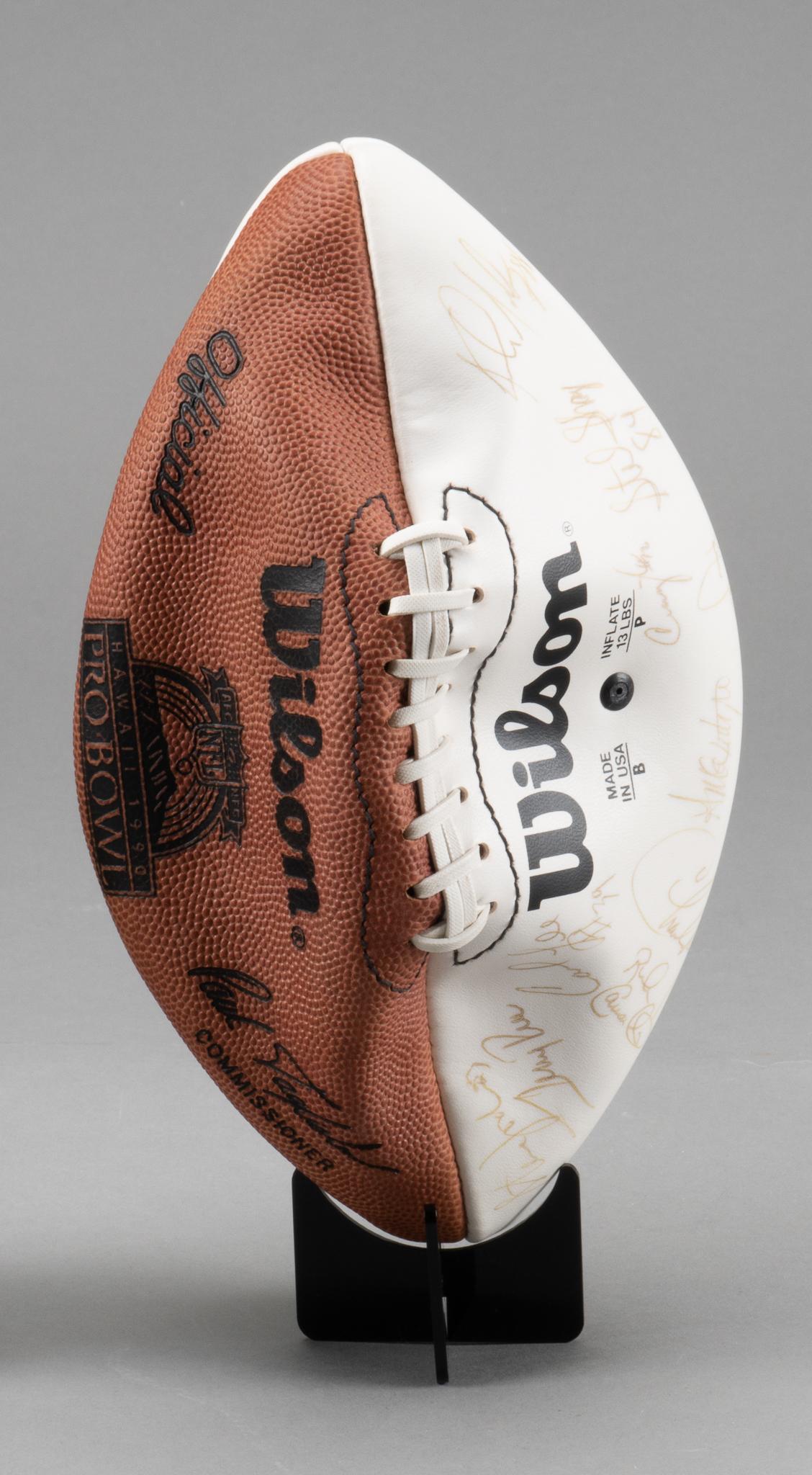 1990 Pro-Bowl Signed WIlson Football: 1990 Pro-Bowl signed Wilson football. Signed by #20 Barry Sanders (Detroit Lions, Hall Of Fame), #64 Randall McDaniel (Minnesota Vikings) Joey Browner (Minnesota Vikings), #62, Guy McIntyre (San Franc