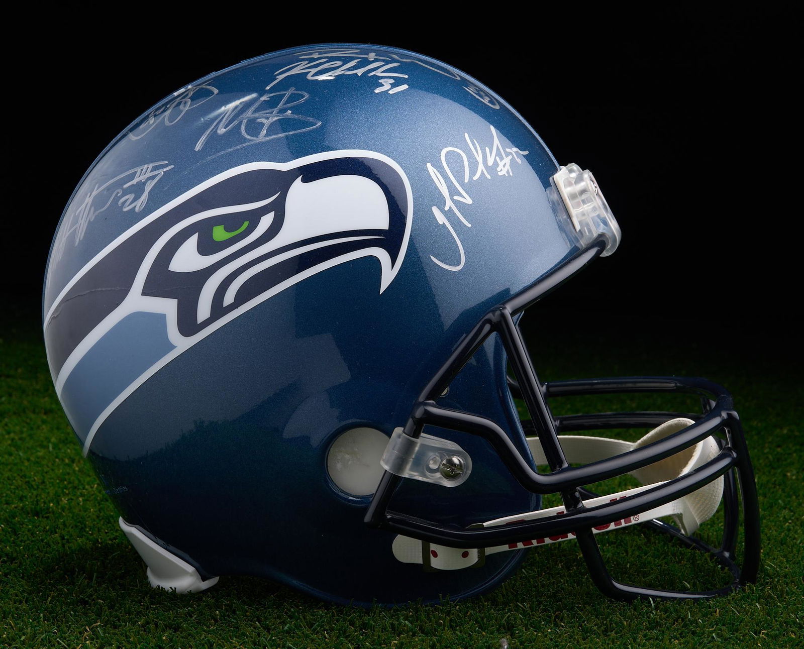 Signed Seattle Seahawks Riddell Helmet: NFL Seattle Seahawks signed Riddell helmet. Signed by Jerry Gray, Defensive Backs coach (Former University of Texas, Los Angeles Rams, Houston Oilers and Tampa Bay Buccaneers player). Also signed by t