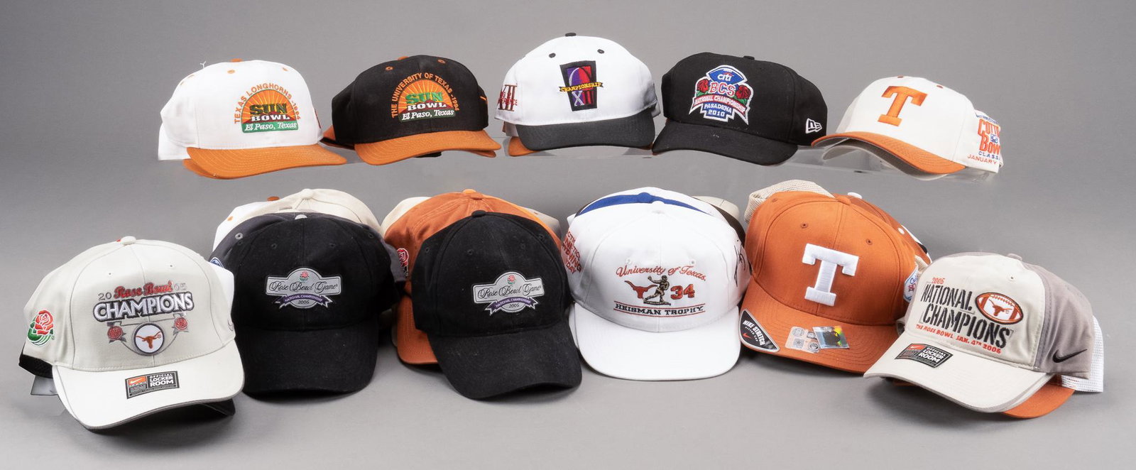 Large Lot of Hats featuring Various Bowl Games: Large lot of hats featuring various football Bowl games 5"h x 10"w x 9.5"d Provenance: The Estate of Larry Falk, University of Texas at Austin Assistant Athletic Director We happily provide seamless s