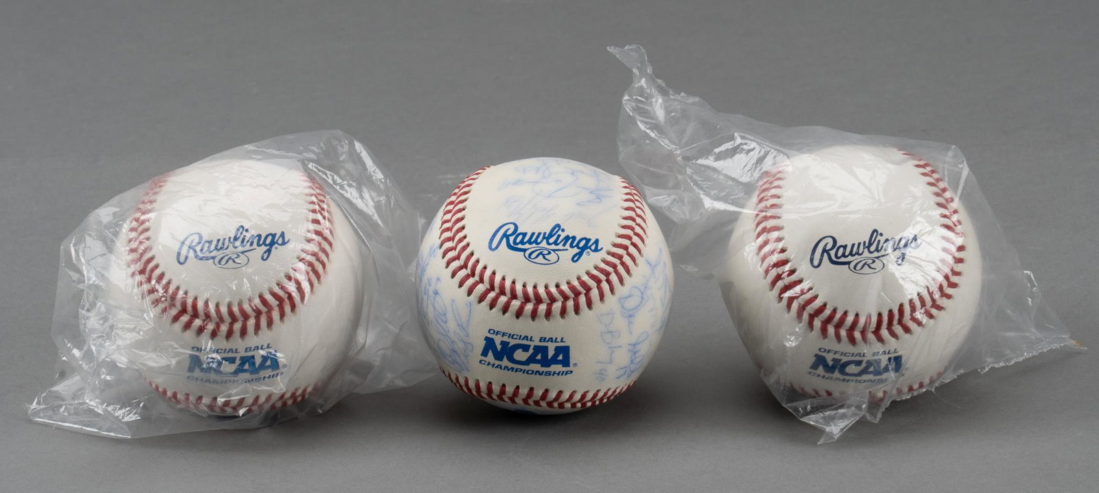 University of Texas 2005 Team Signed Baseball and 2 2002 CWS Unsigned Baseballs: University of Texas team signed 2005 National Champions baseball, signed #44 J.B. Cox, #8 Devid Maroul, #13 Drew Stubbs, #3 Adrian Alvarez, #31 Taylor Teagarden, #2 Seth Johnson, #30 Ken Kasparek, #35