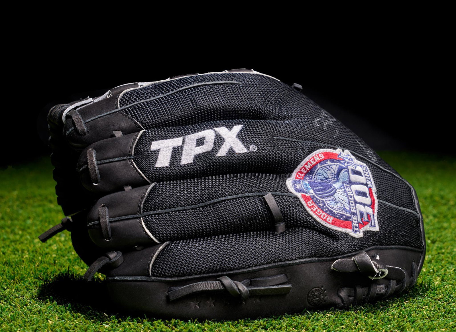 Roger Clemens Signed Louisville Baseball Glove: Louisville TPX Pro left-hand glove signed by Roger Clemens commemorating his 300th win and 4000th strikeout. Signed "300nd/4,000K 6-13-03" and "Roger Clemens 22". 12"h x 7"w x 6"d Provenance: The Esta
