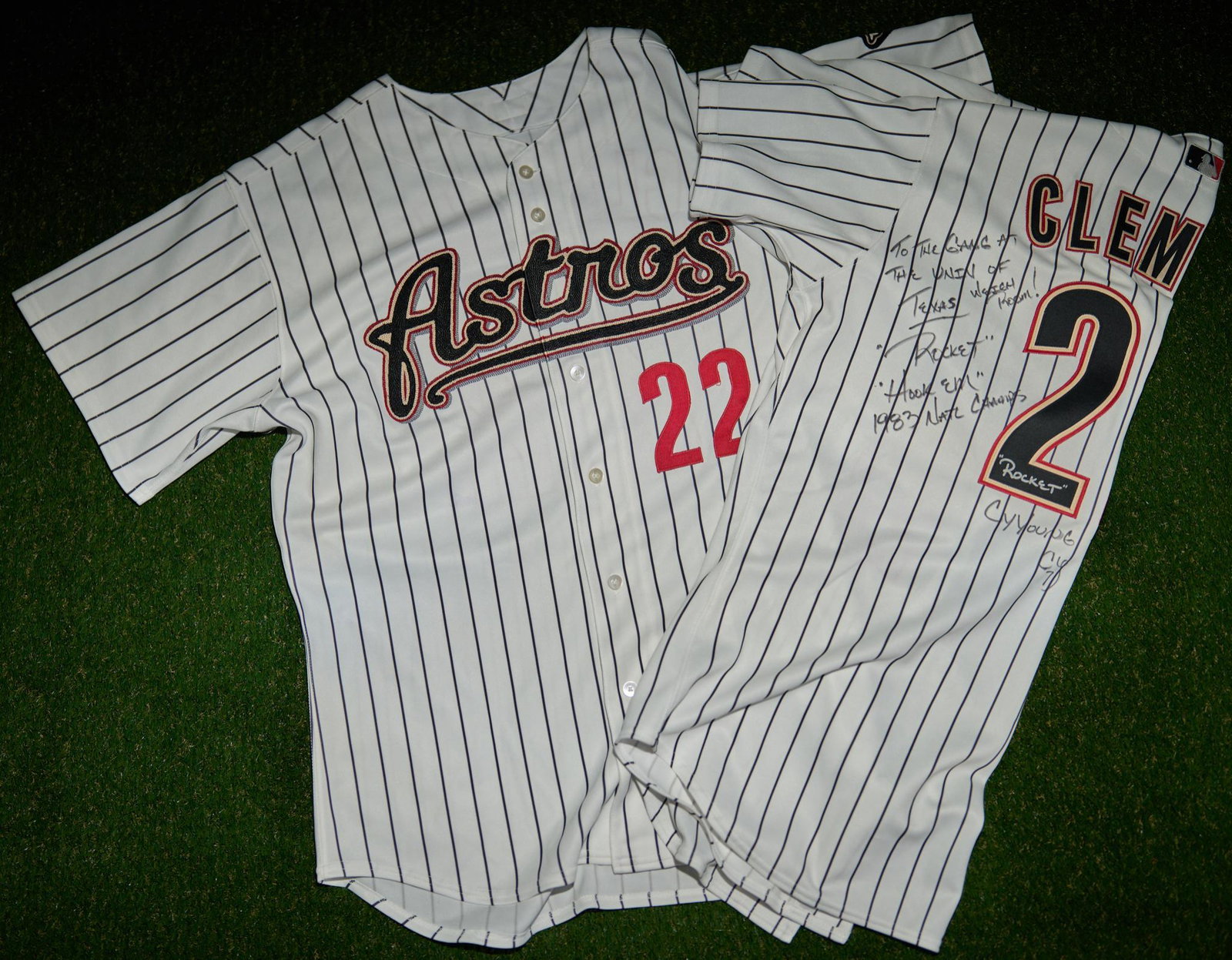 2 Roger Clemens Signed Houston Astros Jerseys: Houston Astros #22 jersey, size 50, with Clemens name on back signed "To the Gang at the Univ of Texas Weight Room!, "Rocket", "Hook Em", 1983 Natl Champs", "Rocket Roger Clemens", "Cy Young 2004, Cy7