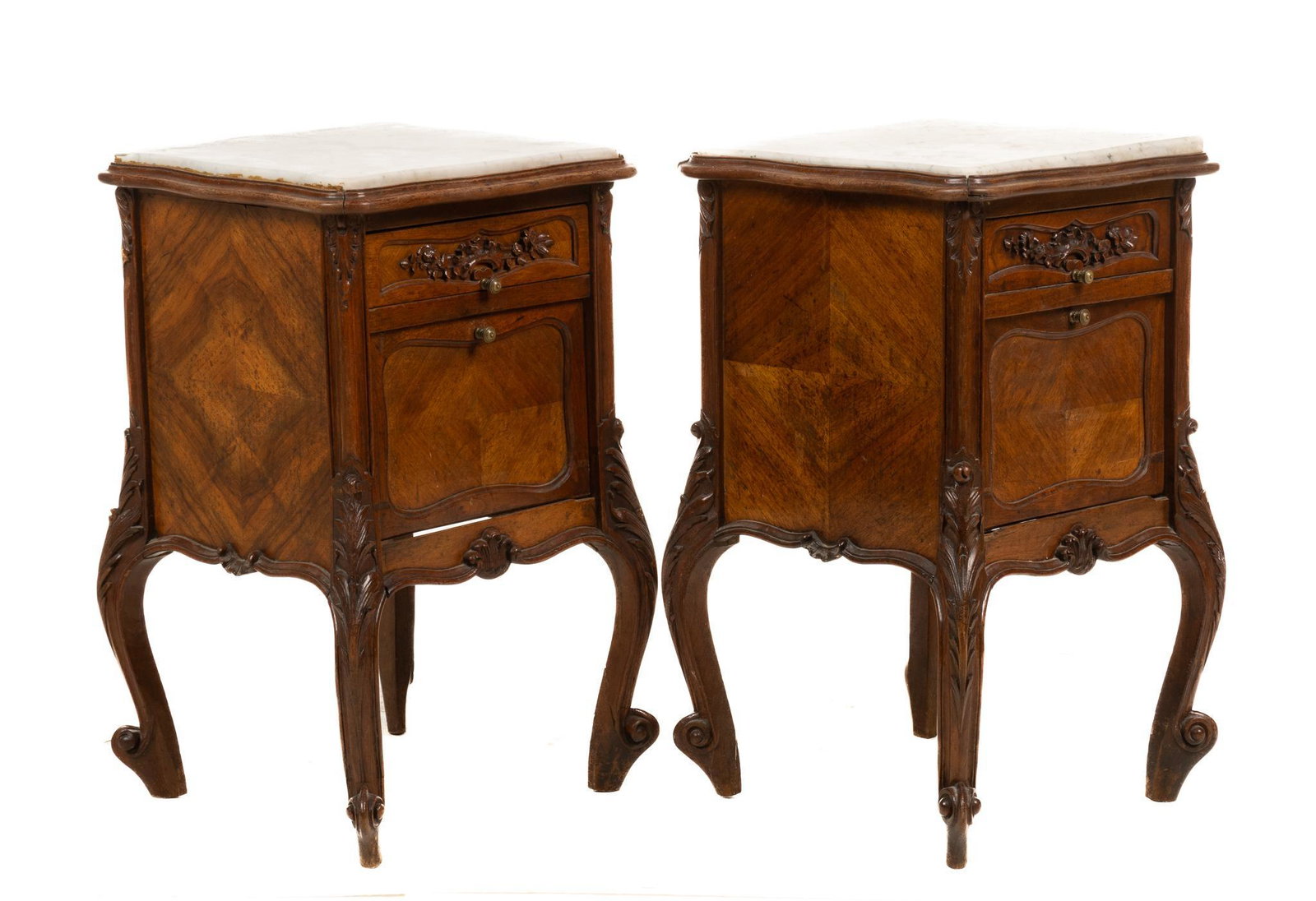 Pair of Louis XV Style Marble Top Nightstands: Pair of matching Louis XV style nightstands, having beveled marble tops, above drawer, featuring carved floral motif, above hinged parquetry door, leading to interior storage, rising on cabriole legs 