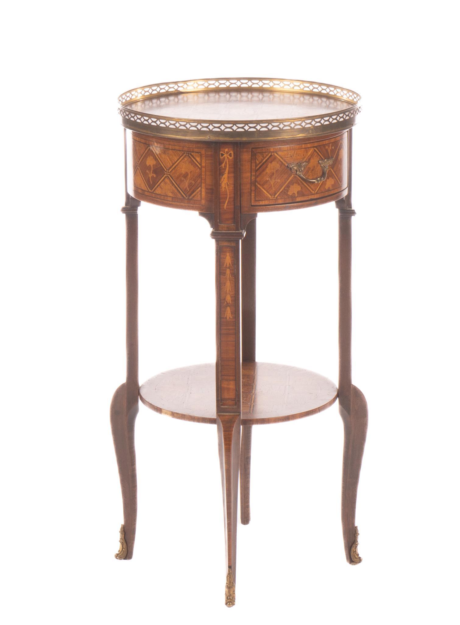Louis XV Style Side Table: Louis XV style two-tiered side table, having pierced brass gallery, above drawer featuring marquetry inlay, rising on tapered legs, ending in cabriole feet, circal 19th century 28..5"h x 14"w 